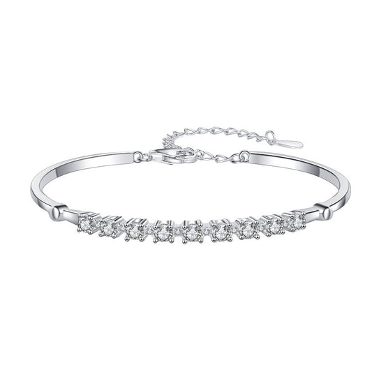 Elegant moissanite tennis bracelet with adjustable chain in silver finish.