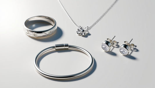 Elegant sterling silver jewellery set featuring a necklace, earrings, bracelet, and ring.