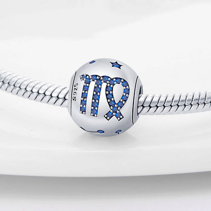 Virgo zodiac charm in sterling silver with blue crystal accents, a stylish addition to personalized jewelry collections.