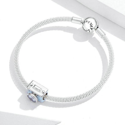 Bracelet with camera charm and 'forever' clasp