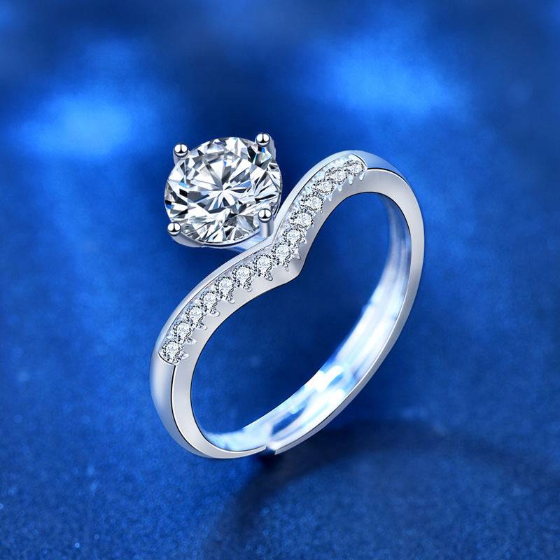 Close-up of the Princess Crown Silver Moissanite Ring showcasing its 1 carat moissanite stone. The silver band features delicate embedded stones.