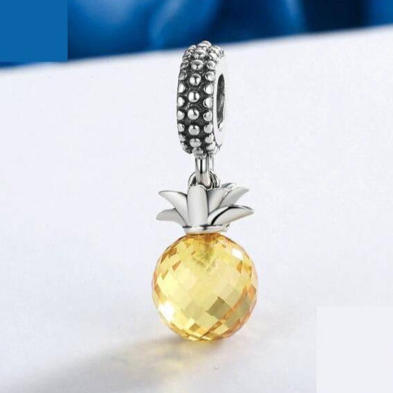 Elegant Tropical Pineapple Charm featuring a sparkling yellow gemstone and silver accents, ideal for adding a tropical touch to any bracelet.