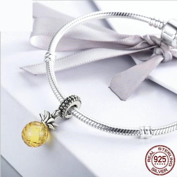 925 Sterling Silver Pineapple Charm with a faceted yellow gemstone, a trendy and elegant addition to charm bracelets and summer jewelry.