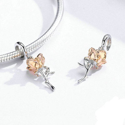 Pair of gold rose charms with silver stems