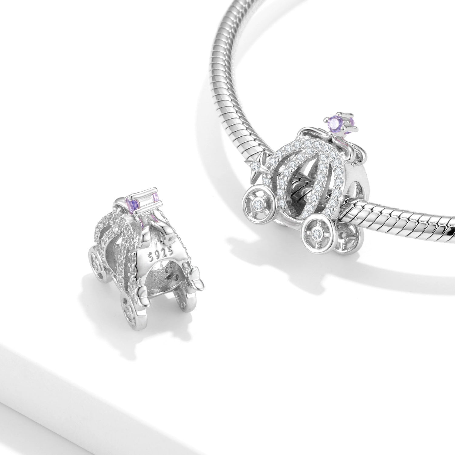 Elegant Carriage Charm displayed on a bracelet, showcasing its detailed craftsmanship and whimsical appeal.