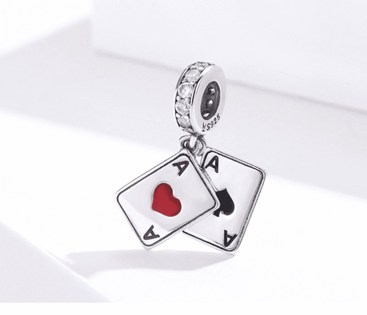 Detailed view of playing cards charm with heart and spade