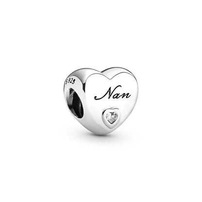 Heart-shaped nan charm with clear gem