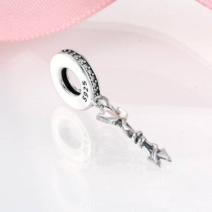 Silver arrow charm with sparkling accents