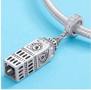 Sterling silver Big Ben Charm attached to a charm bracelet, showcasing its intricate design and craftsmanship.