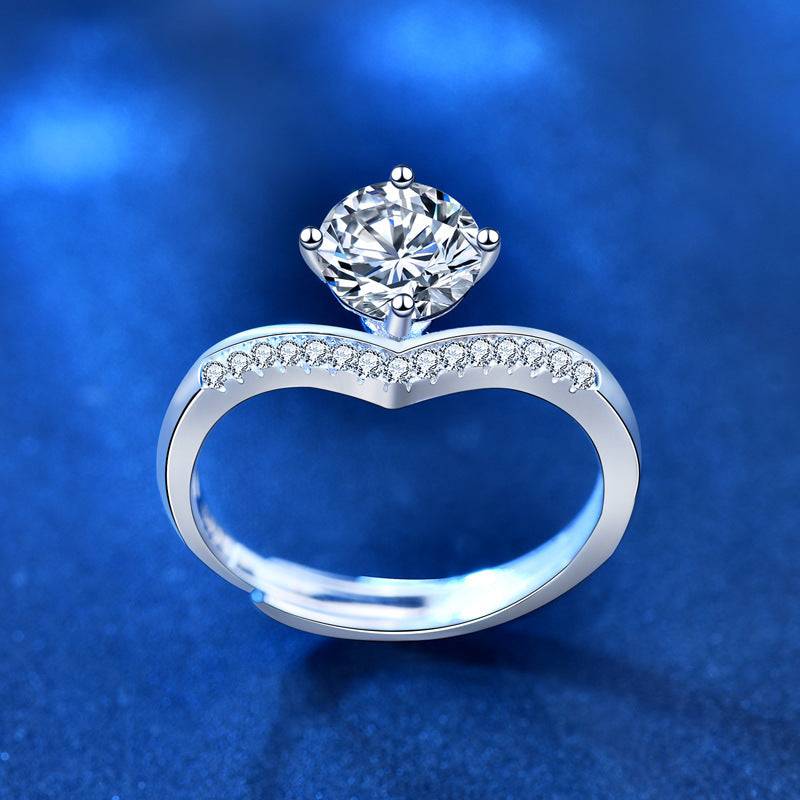 Side view of the Princess Crown Silver Moissanite Ring highlighting its intricate design. Features a 1 carat moissanite stone and embedded accents.