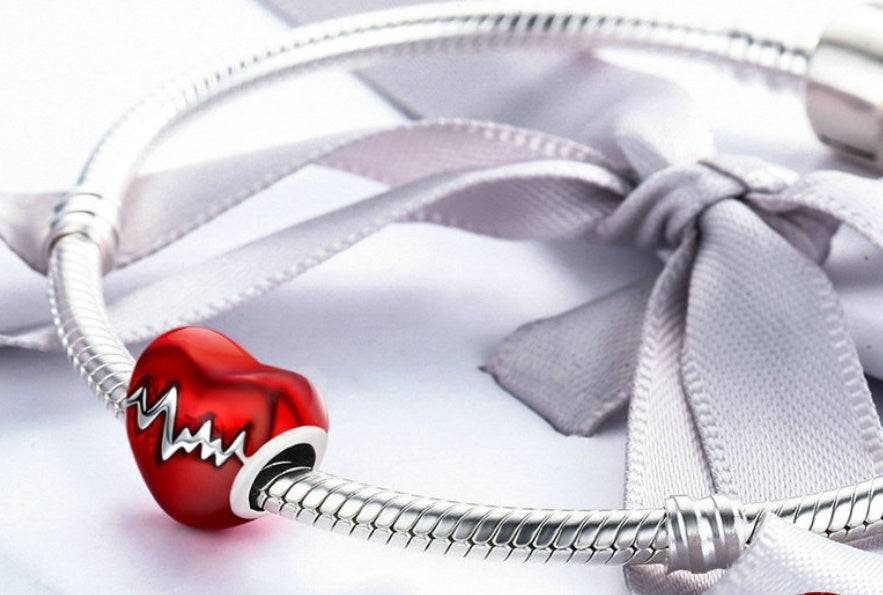 Heartbeat Charm Bracelet Accessory featuring a red heart with a silver heartbeat pattern, designed for necklaces or bracelets.