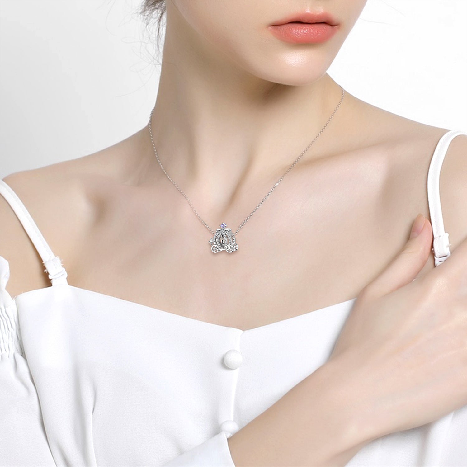 Carriage Charm worn as a necklace, adding a whimsical and elegant touch to any outfit.