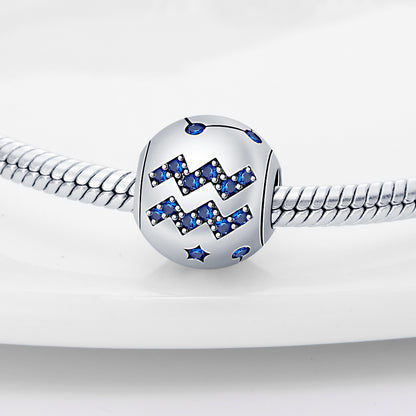 Aquarius zodiac charm in sterling silver with blue crystal accents, perfect for adding a personalized touch to bracelets.