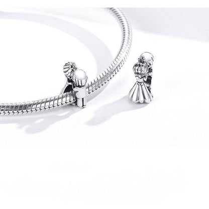 Couple charm on a silver bracelet