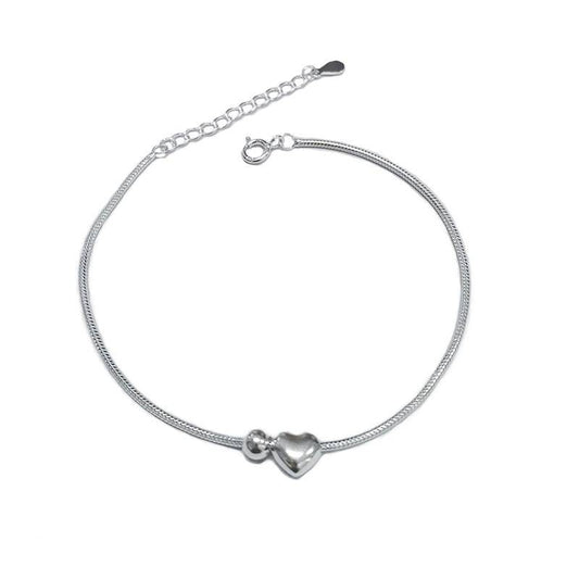 Heart Bead Silver Bracelet featuring a delicate silver chain with a heart-shaped charm, perfect for romantic and timeless jewelry lovers.