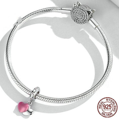 Silver bracelet with Pink Heart Tag Charm, showcasing a pink enamel heart and sterling silver design with crystal details.