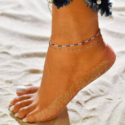 Elegant anklet on sandy beach