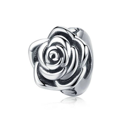 Silver rose charm with intricate details