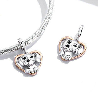 Two puppy charms with heart design on bracelet